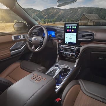 An interior shot of the front seats and dash of the Ford Explorer