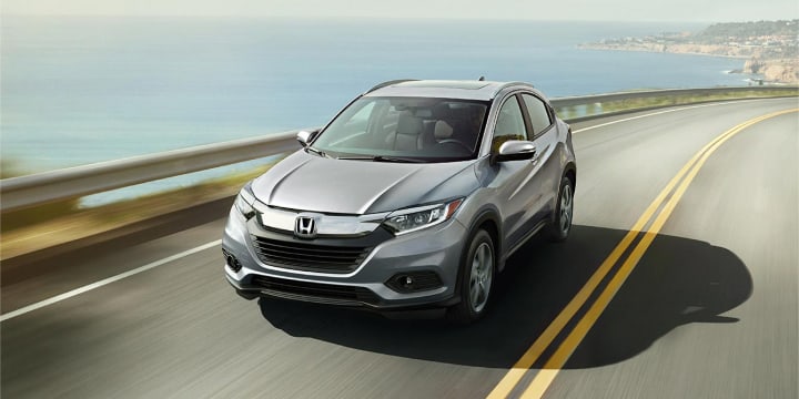 Silver HR-V driving near the shore