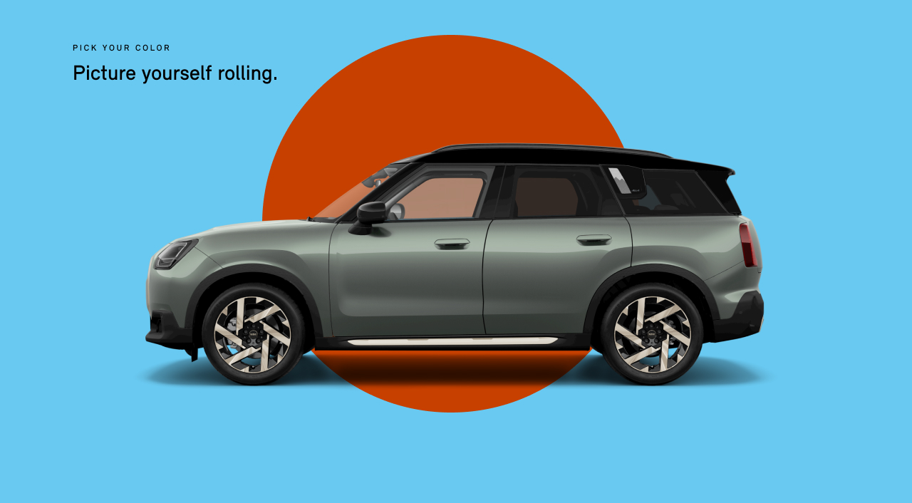 Side view of a MINI Countryman SE All4 in the Smokey Green body color, facing left with its shadow underneath it.