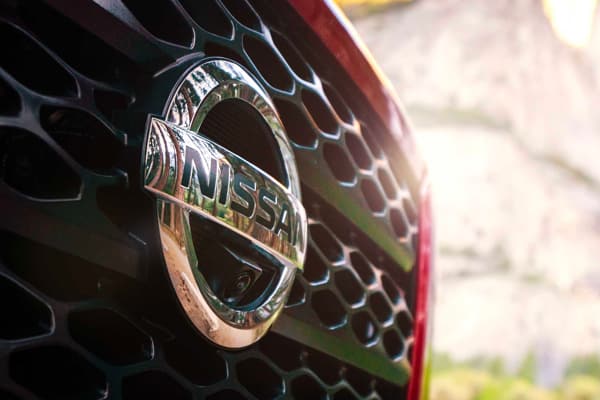 Front grille of Nissan vehicle with logo