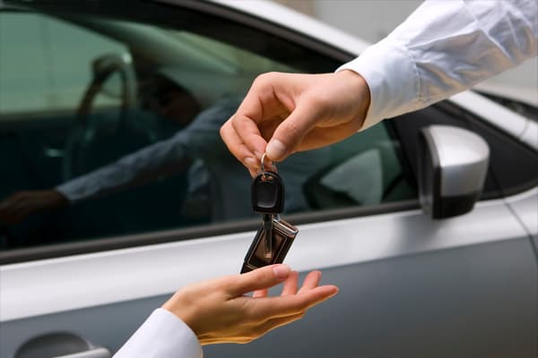 Two people exchanging keys