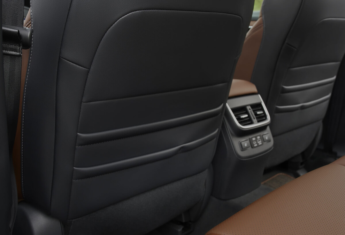 Backseat perspective of the 2023 Subaru SUV front seat cargo pockets